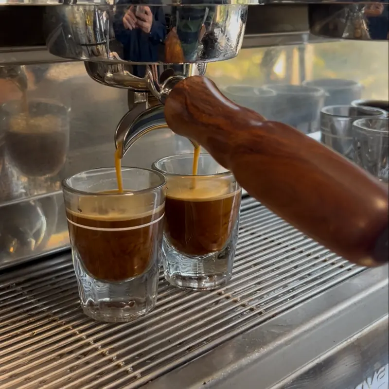 Two espresso shots pouring from the machine