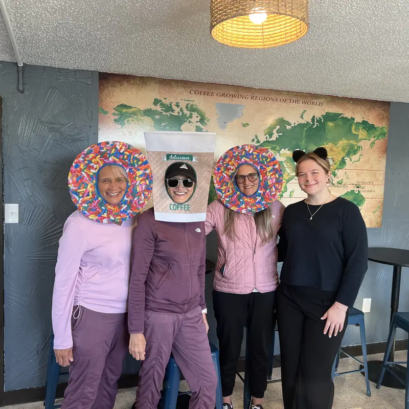 Guests in Halloween costumes inside the shop