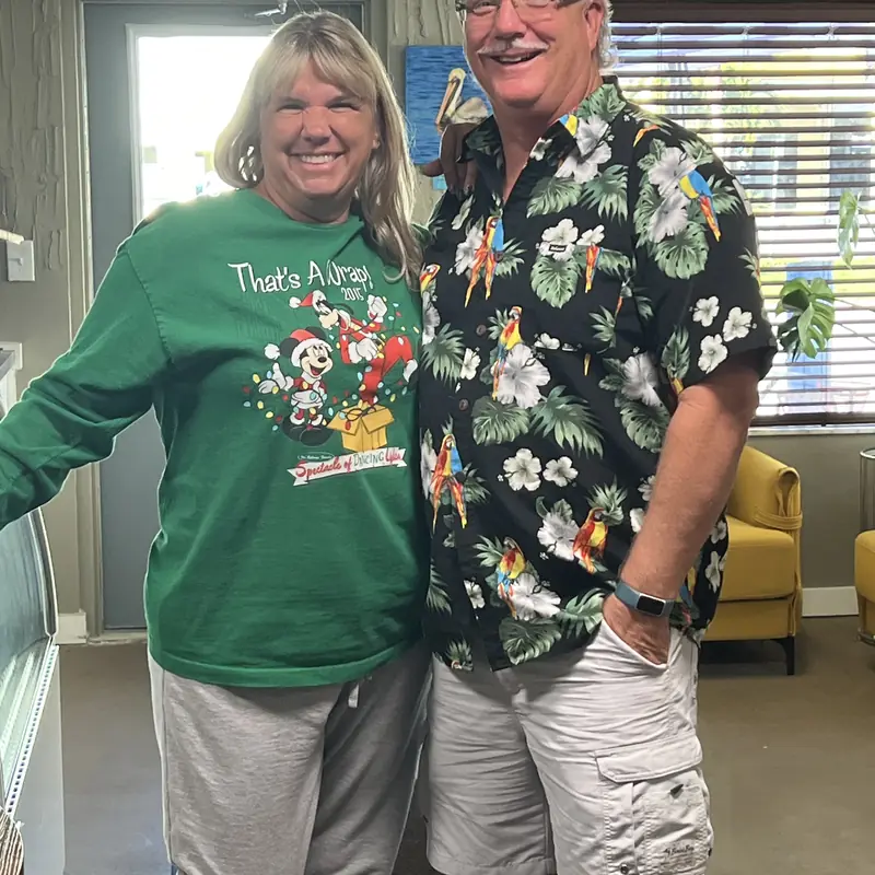 Two guests dressed for the holidays inside the shop